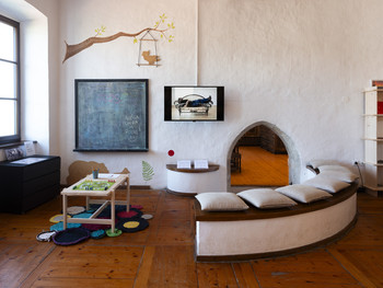 Video area of the Museum’s Living Room, where visitors can watch a compilation of Furlan’s video performances titled Wear I–XVII (2005–2014). <em>Photo: Lucija Rosc</em>