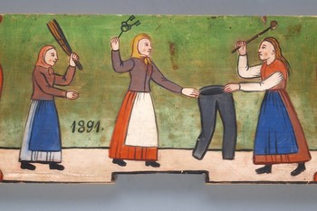 Boj za moške hlače, motiv smešenja žensk, Selška delavnica, 19. stoletje <em>Foto: Marko Habič. Hrani Slovenski etnografski muzej</em>