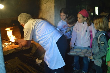 Baking bread in the Škopar s house <em>Photo: Škofja Loka Museum Photo Archive</em>