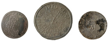 A silver coin with the depiction of Bishop of Freising Johann Francis and two inscribed pewter medallions 