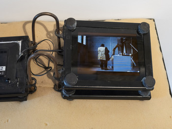 Tomaž Furlan: Book (the video Wear III, 2005, playing on the screen), 2010, Škofja Loka Museum <em>Photo: Lucija Rosc</em>